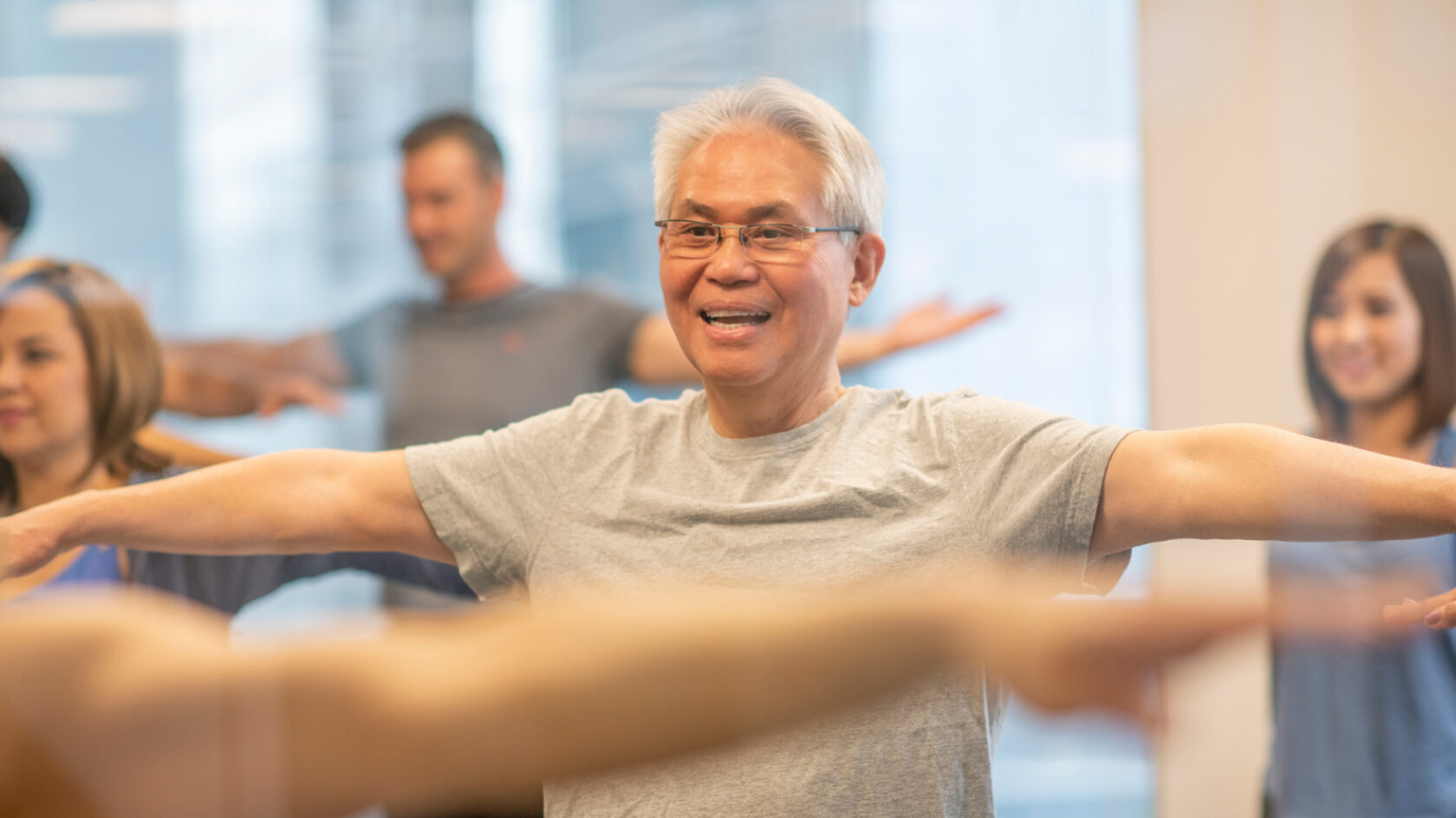 A man participates in an exercise class.