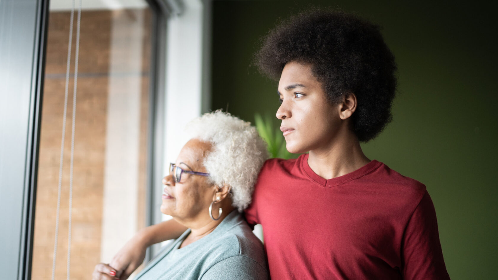 A grandson and a grandmother enjoy a quiet moment together.