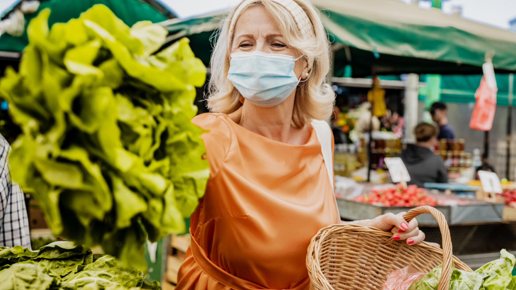 A woman shops at a farmer’s market.